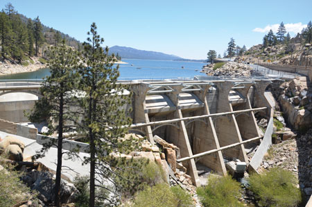 Bear Valley Dam is a 92-foot-high multiple barrel arch dam in southern California. Work to ensure the spillway gates were ready to operate was required in the event of a large rainfall event from El Nino.