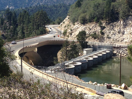 This upstream view of Bear Valley Dam shows the level of the reservoir, which was 13 feet down from normal pool last fall, the lowest the reservoir has been in more than a decade.