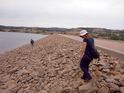 A comprehensive review examination of the upstream face of an embankment dam is completed by Bureau of Reclamation personnel.